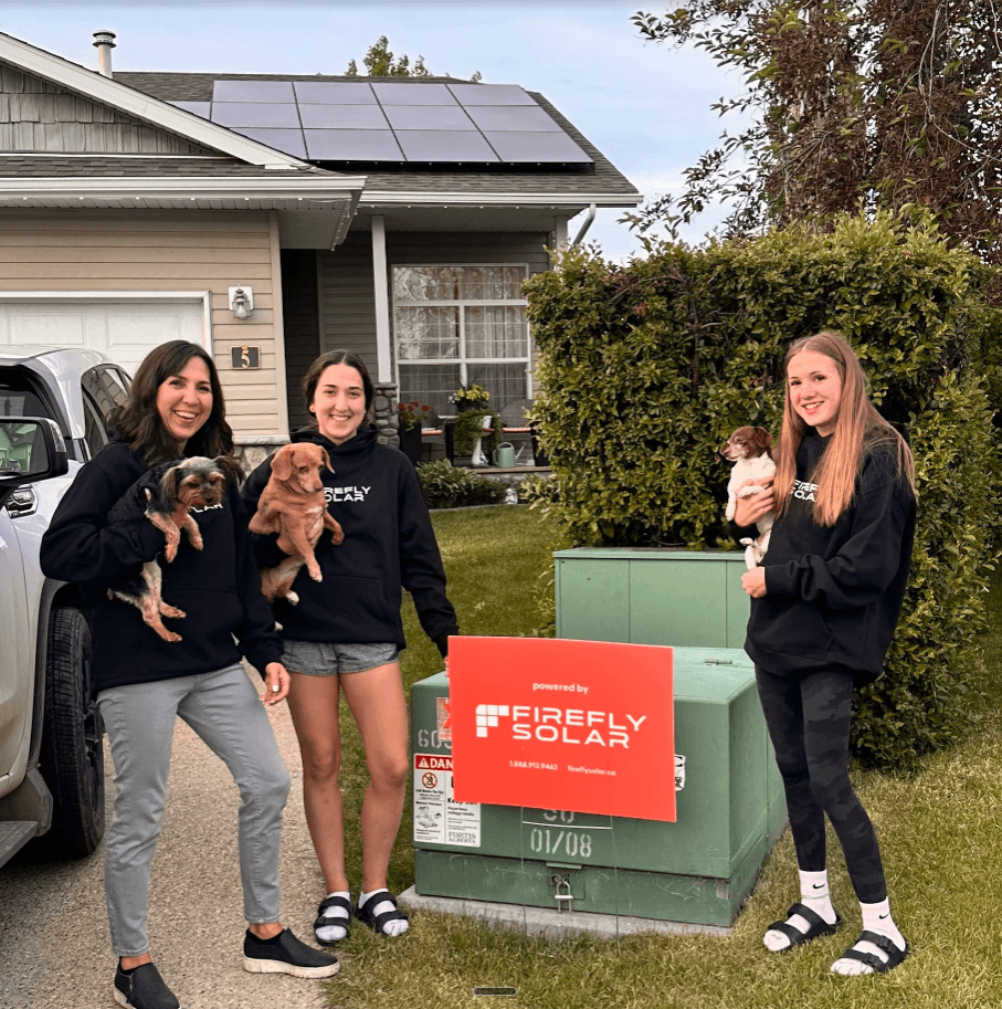 Family with Firefly Solar sign and solar panels