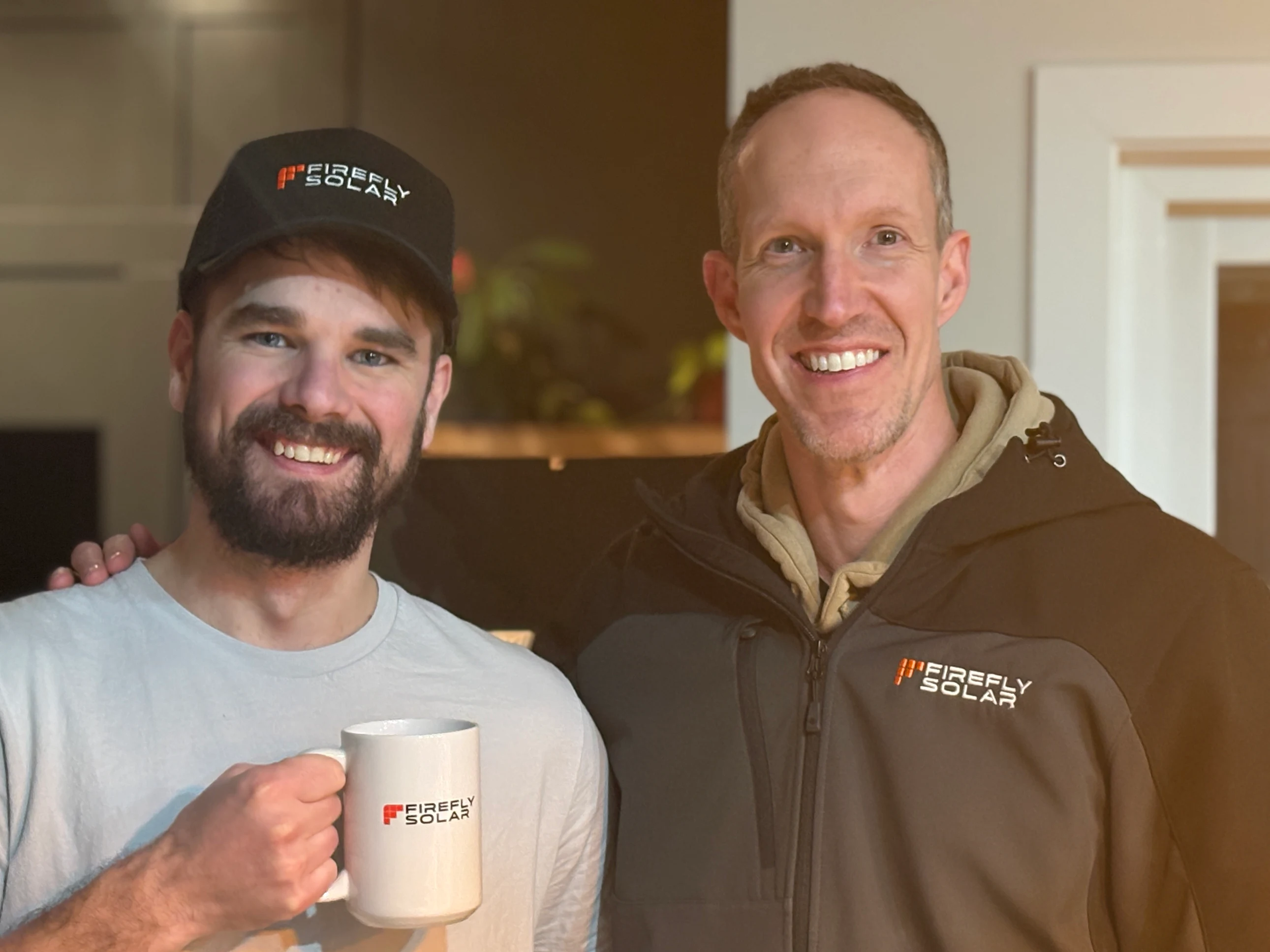 Customer and Firefly Solar team member with mug