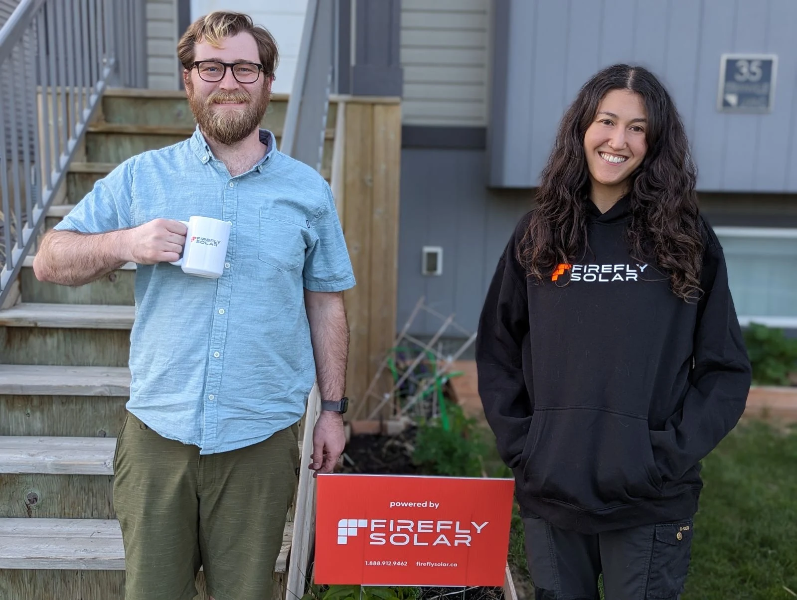 Customer with Firefly Solar team at their home